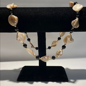 Elegant Black and Gold Necklace with Chevron Design